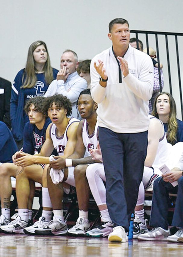 LEE UNIVERSITY head men's hoop coach Ryan &quot;Bubba&quot; Smith recently notched his career 300th coaching victory, including 100 wins with the Flames. His current squad is ranked nationally and atop the GSC standings.