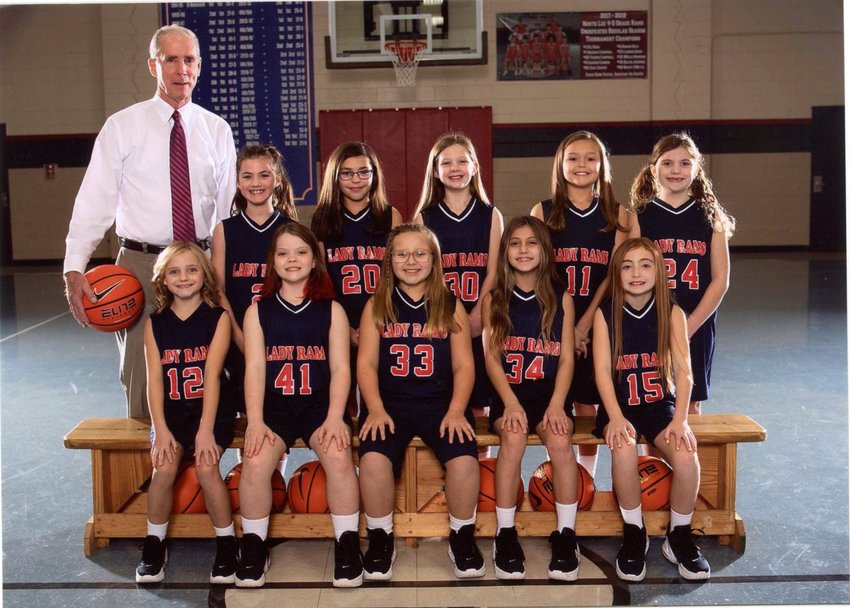 THE LADY RAMS of North Lee won the first-third grade Bradley County Elementary School league and tournament championships this past season. Coach David Hancock's squad went 26-3 on the campaign. Team members include, seated from left, Finlee Holt, Brooklyn Smith, Kinley Hicks, Tynslee Tarver, Sadie Jones; standing, head coach David Hancock, Ady Stroud, Zoey Braun, Kristian Moore, Alivia Estrada and Arianna Cole.