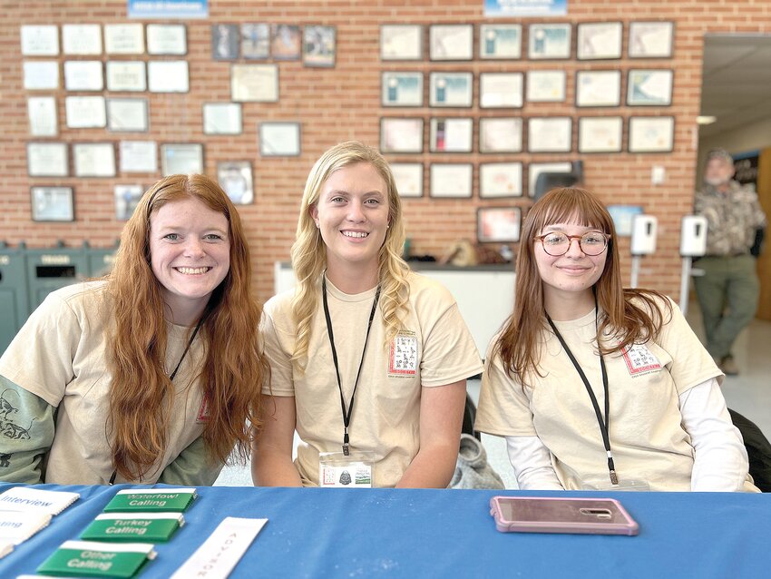 CSCC students Ireland Robinson-Johnson, from left, Kaitlyn Taylor and Madison Gilley worked the registration table at the Southeastern Wildlife Conclave.