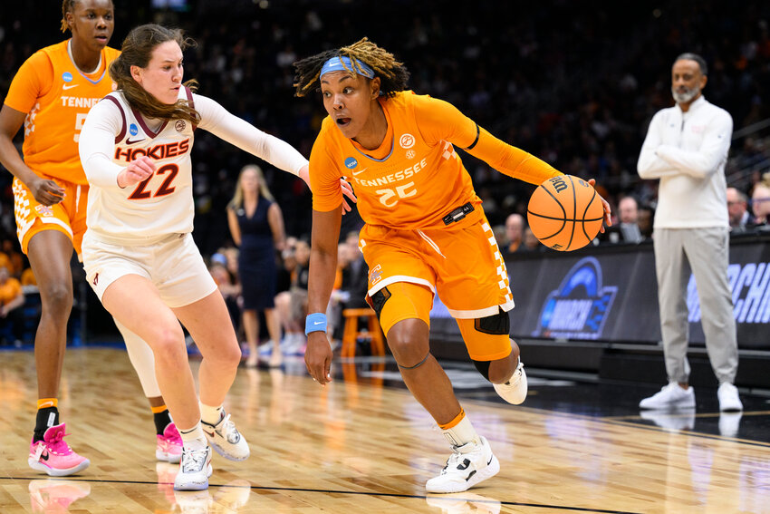 TENNESSEE GUARD guard Jordan Horston (25) drives towards the basket as Virginia Tech guard Cayla King (22) defends in the first quarter of a Sweet 16 college basketball game of the NCAA Tournament in Seattle, Saturday, March 25, 2023. (AP Photo/Caean Couto)