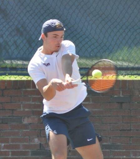 LEE UNIVERSITY'S Quinn Groenendijk posted a win at No. 5 singles to clinch the 14th-ranked Flames  win over the No. 19-ranked Mississippi College, Saturday in Clinton, Miss..