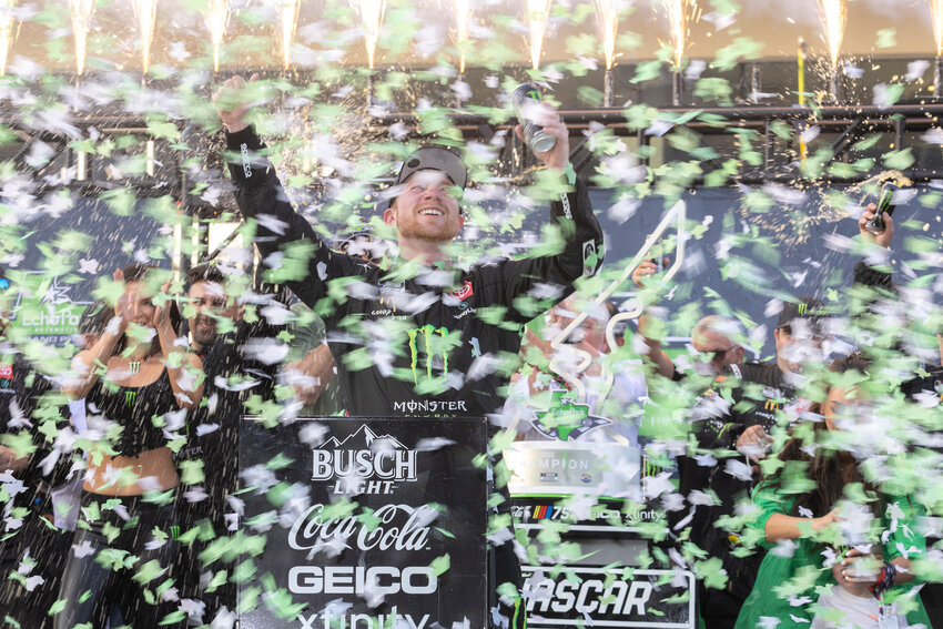 TYLER REDDICK, center, celebrates after winning a NASCAR Cup Series race at Circuit of the Americas, Sunday, in Austin, Texas.