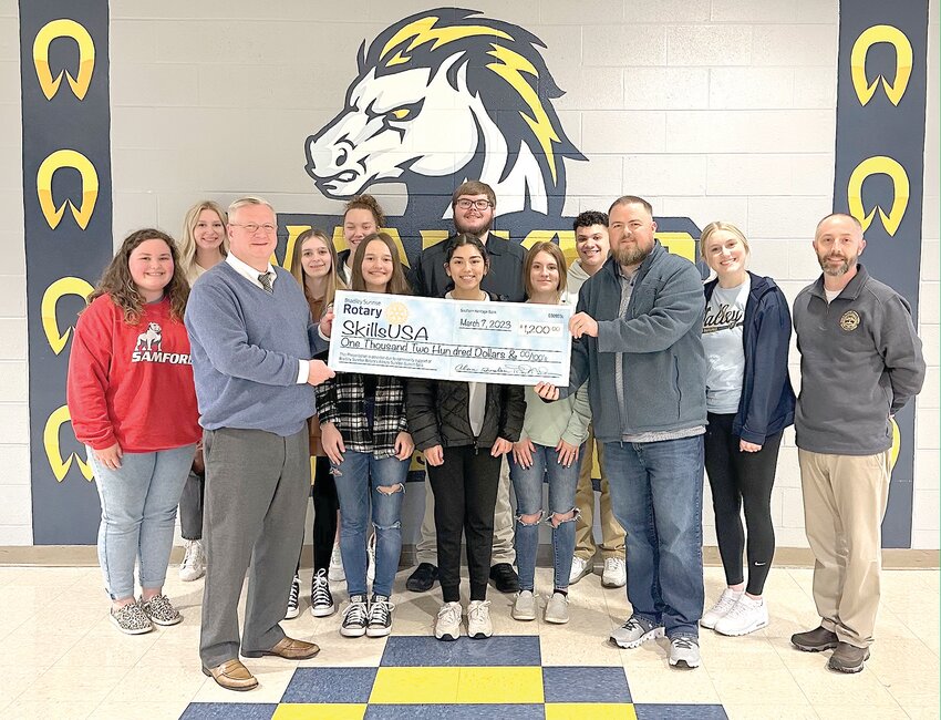 WALKER VALLEY HIGH's SkillsUSA received a $1,200 check from the Bradley Sunrise Rotary Club. Allen Murphy, president of the Sunrise Rotary Club, holding check on left, presented the donation to Matt Parris, Walker Valley High criminal justice teacher. Students pictured are Ella Hooper, Makenzie Gilson, Emma LaBean, Jalaya Lindsey, Charlee Snyder, Katherine Tenorio, Taylor Owens, Kenzie Watkins, Zayden Francis and Madalyn Tucker. Also pictured is Marshal Hicks, investigator for the 10th Judicial District Attorney's Office.
