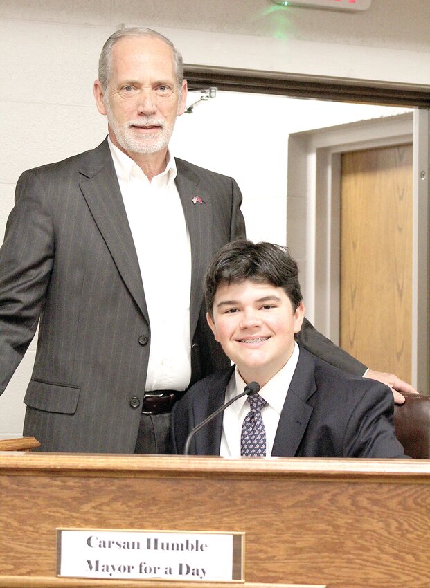 WILL THE REAL MAYOR PLEASE STAND UP? Mayor D. Gary Davis, left, stands by mayor for a day winner, Carsan Humble.