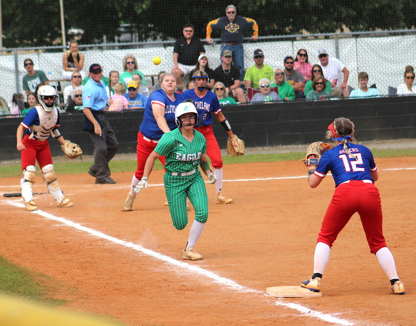 CLEVELAND HUNIOR hurler Ashley Allen throws to second baseman Landri Nelson, who was covering first, for the out on a bunt sacrifice by Rhea County during the District 5-4A winner's bracket final  Saturday, at Bob McKenzie Field.