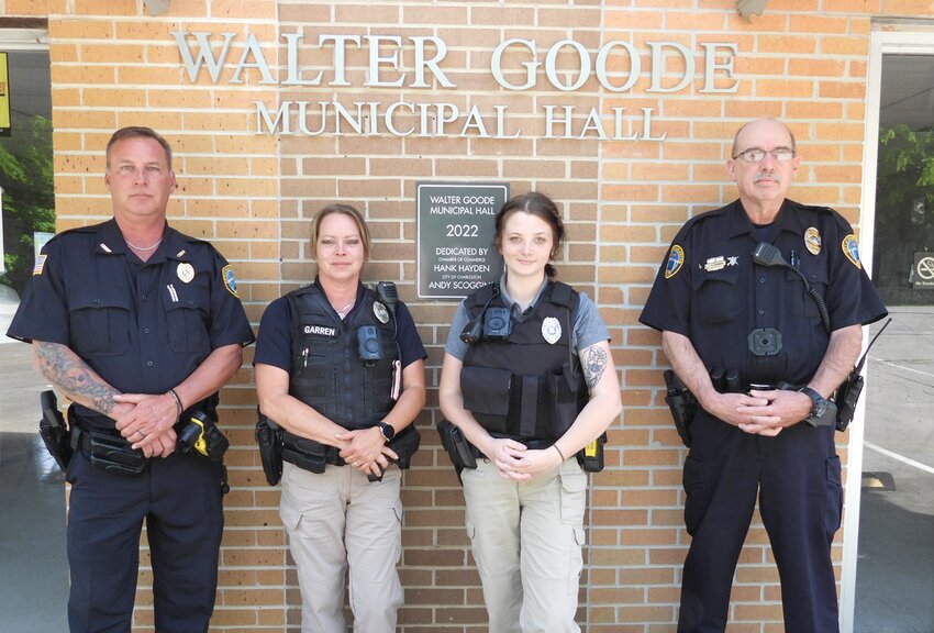 SAVANNA BISHOP is the newest officer with the Charleston Police Department, beginning on May 2 serving the city. She was sworn in by Judge Robert Wilson earlier this month, and joins the four-person force. From left are Charleston Police Chief Jody Musselwhite, and Officers Brenda Garren, Bishop and David Spandau.