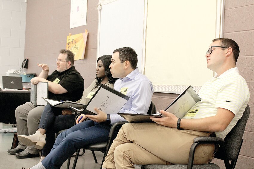 THE SHARKS evaluated the students' products, with some choosing to &quot;invest&quot; after their pitches. From left are Shane Brown, director of education at Lee University; Natasha Goodridge, a nurse; Ian Raymond, underwriter supervisor at Auto-Owners Insurance; and Nolan McDaniel, founder and executive director of ChattAcademy Community School.