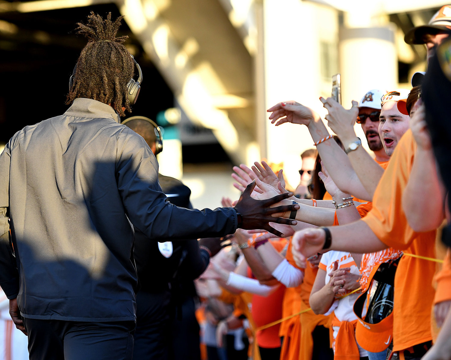 Tennessee Volunteers fans greet players and coaches as they arrive at TIAA Bank Field for the Gator Bowl NCAA football game against the Indiana Hoosiers Thursday, Jan. 2, 2020.