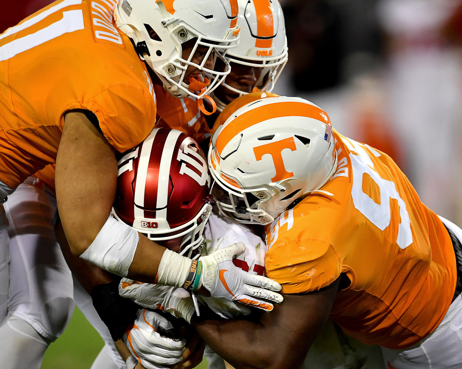Indiana Hoosiers quarterback Peyton Ramsey (12) is sacked by Tennessee Volunteers defensive lineman Matthew Butler (94), linebacker Shanon Reid (21) and Tennessee linebacker Henry To'o To'o (11) in the first half of the Gator Bowl NCAA football game Thursday, January 2, 2020, at TIAA Bank Field in Jacksonville, Fla.