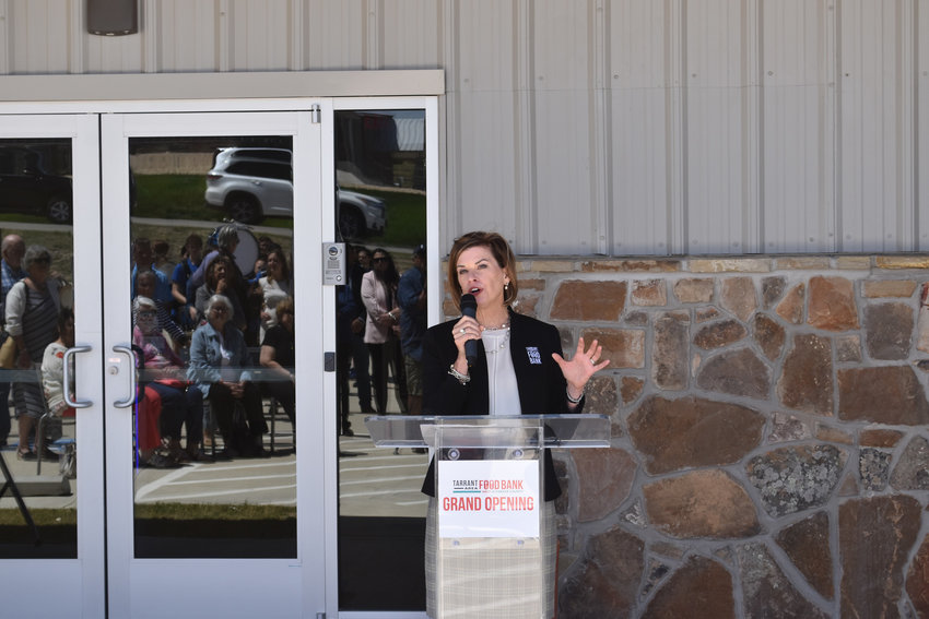 Julie Butner, president and chief executive officer of the Tarrant Area Food Bank, welcomed the crowd that gathered for thhe grand opening of the west Parker County facility on April 14.