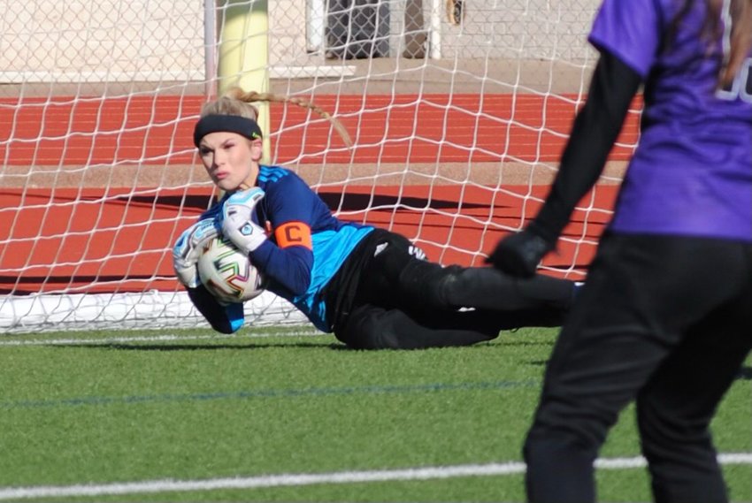Emma makes a save during an Aledo Ladycats soccer game.