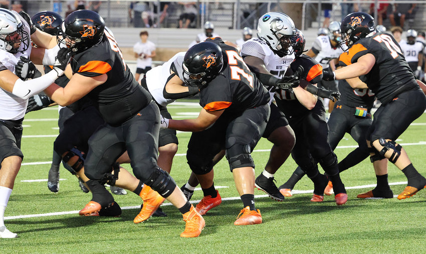 Aledo's offensive line at work.