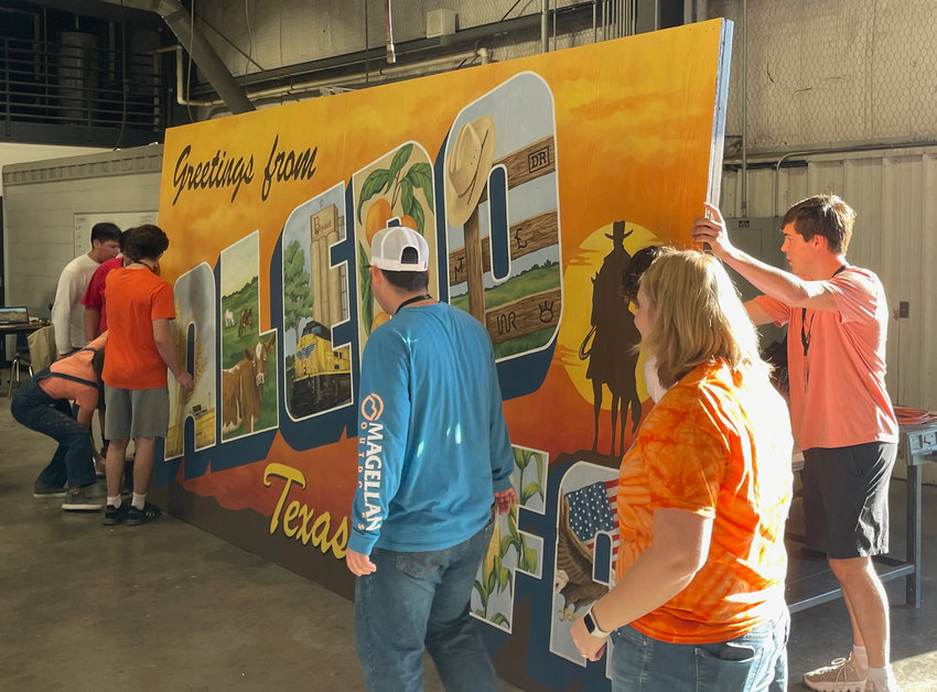 Students prepare to move the mural.