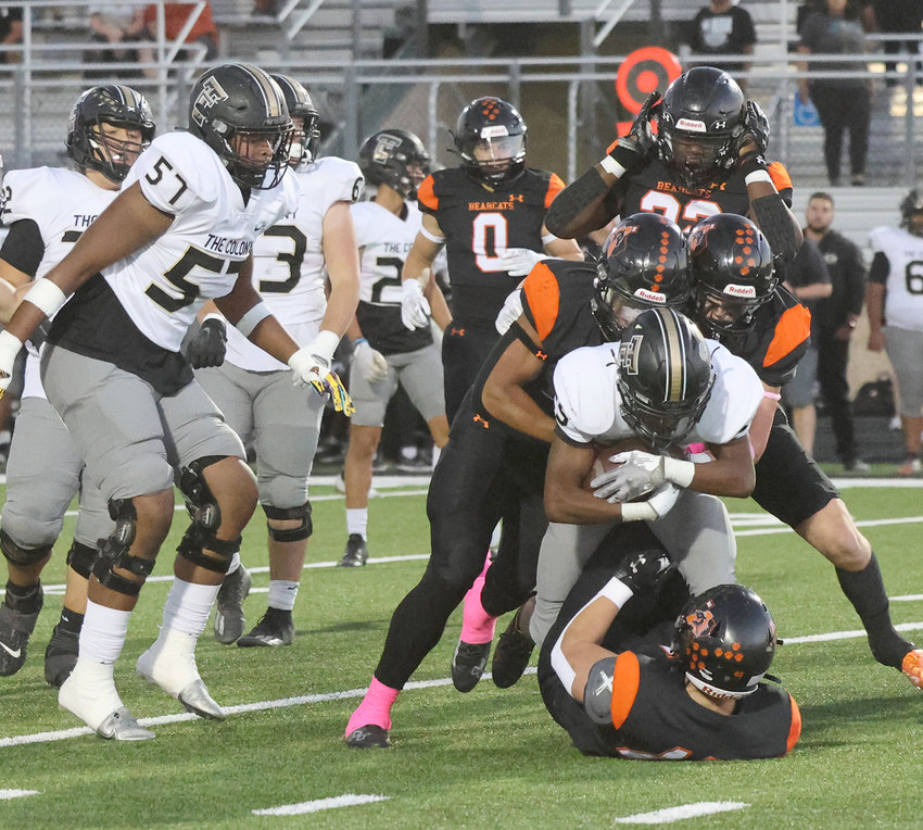 Ky Howington (5) and Dahvon Keys (3) bring down a runner from The Colony in Friday night action.