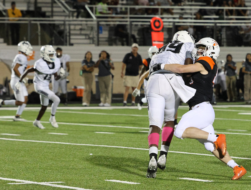 Kenneth Lohmer (45) makes a tackle against South Hills.