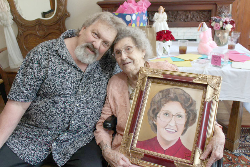Claire Whisenant is shown with Danny Norris, who painted her portrait several years ago. They saw each other at her 100th birthday party at Angel's Nest Bed and Breakfast in Weatherford.