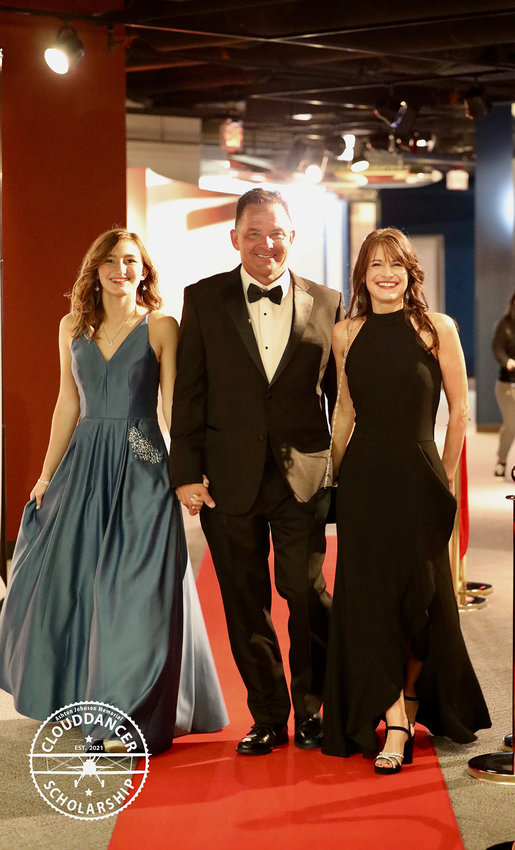 Capt. Joe Johnson with daughter Kaylee on the left and wife Shelli on the right at the inaugural CloudDancer Black Tie Gala.