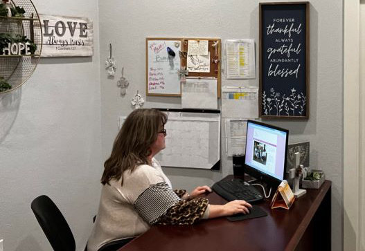 Elizabeth Mederos is hard at work in her office as a case management counselor for Sanctified Hope after having gone through the program herself upon her release from prison..