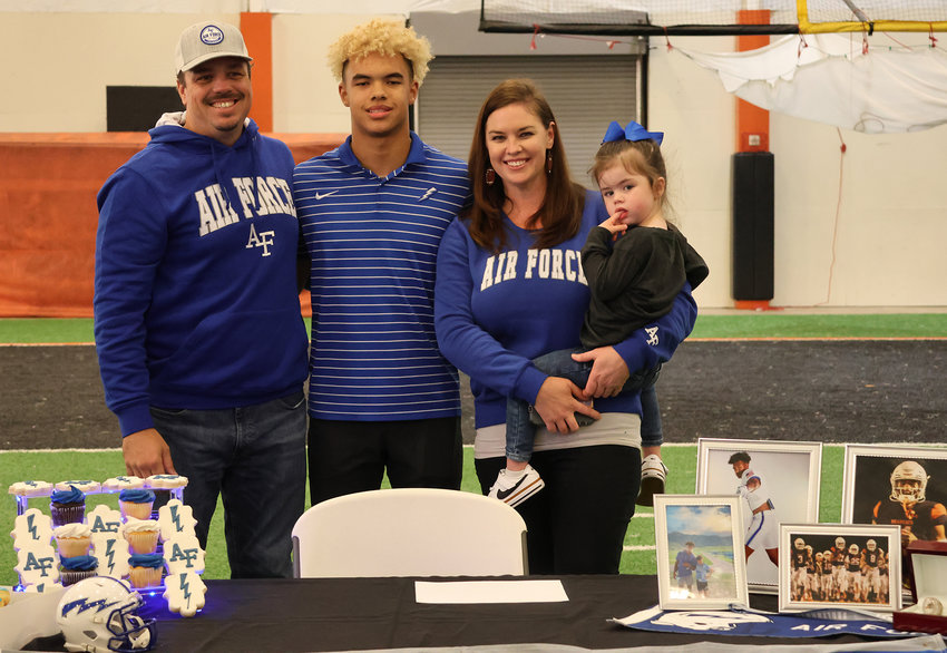 Jalen Pope will play football at the Air Force Academy. He is shown with Cassie, Adam, Addison, and (not pictured) Jackson Pope.