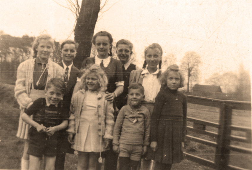 'Katie' Gisela's Confirmation, April 10, 1949, surrounded by friends and relatives (several of which she stays in touch with today). Gisela (14) is by the tree, decked out in a dress with a white collar.  In less than ten months, Gisela's family moved to the United States.