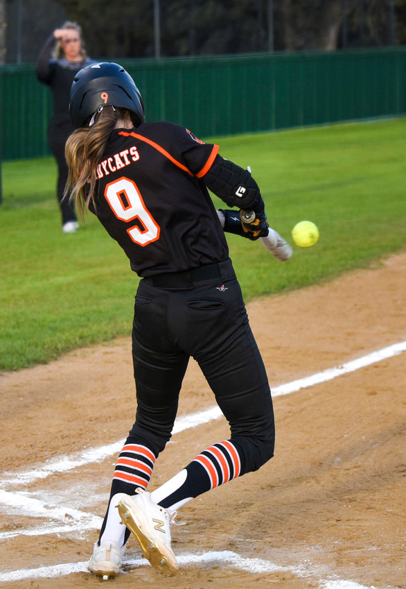 Addie Perry gets the game started with a hit against the Azle Hornets on March 21.