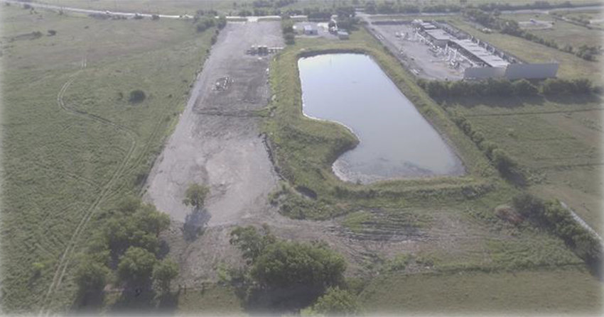 An aerial view shows the location of a new fire training center on Farmer Road. The land includes a two-acre reservoir.