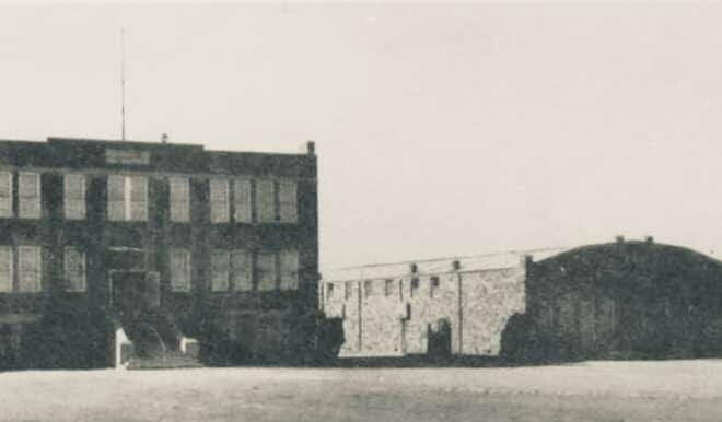 The old Aledo High School is shown next to the rock gym, which was constructed in 1937 and is still in use today.