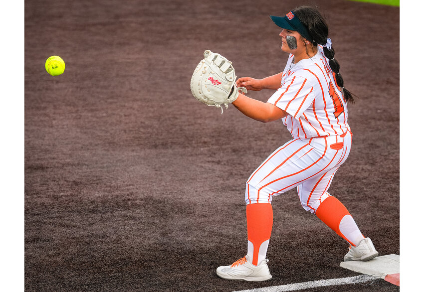 Ladycat first baseman, Texas Ray, prepares to catch the ball as Aledo records an out during the final home game of the 2023 season on Wednesday, April 19.