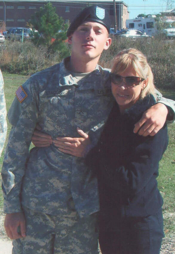 Austin Staggs gives his mom, Kaye Jordan, a hug. Austin lost his life in Afghanistan. Kaye is president of Gold Star Families in Parker County, an organization that honors families who lost a loved one in war..
