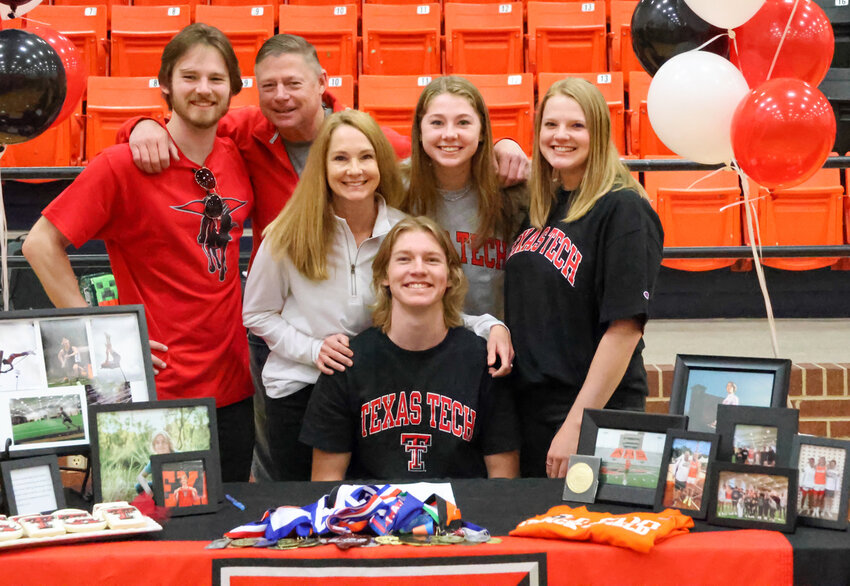 Sean Gribble signed with Texas Tech University in pole vaulting. He is shown with David, Sharon, Morgan, Alyssa, and Kyle Gribble.