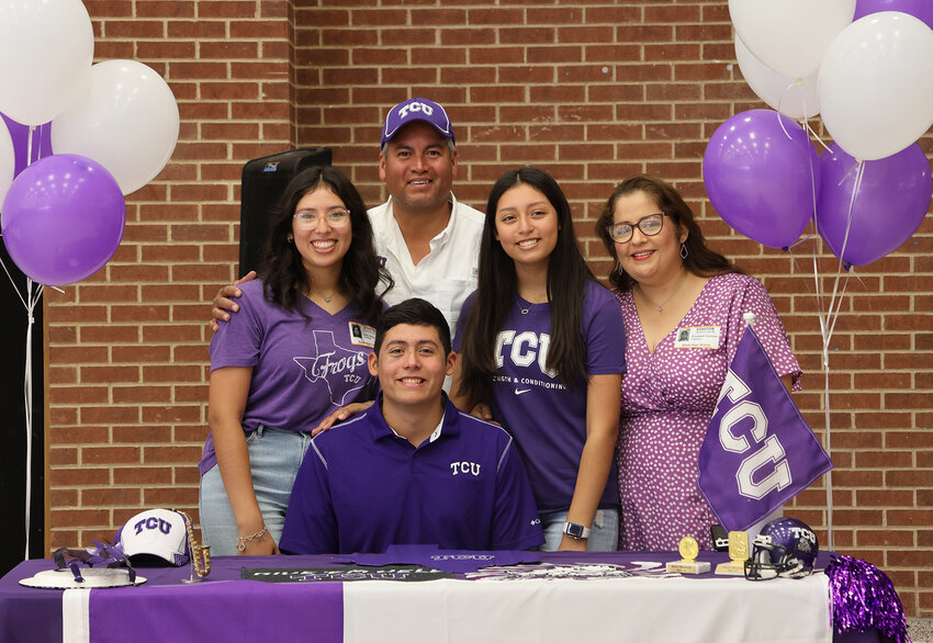 Gerry Olazaran signed with TCU in band. He is shown with Elizabeth and Hector Olazaran and Amy and Adriana Olazaran.
