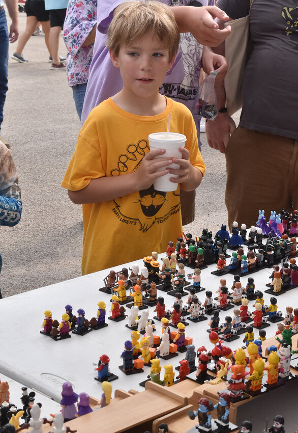 Oliver Burns checks out the hundreds of miniature figures on display.
