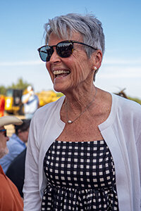 Lynn McKinney is all smiles as she greets members of the community prior to the ceremonial groundbreaking event for new elementary school named in her honor on Thursday, July 20.