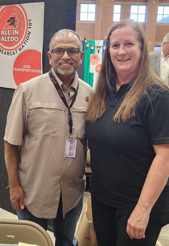 Director of Transportation Ranjan George and Routing Coordinator Lisa Grace iare shown n the AISD transportation booth..