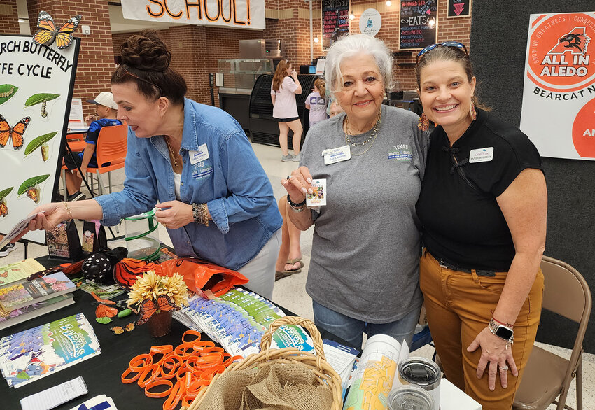 (From left) Eryka Swyryn, Gay Larson, and Annetta Mayor Sandy Roberts share information about Monarch butterflies.