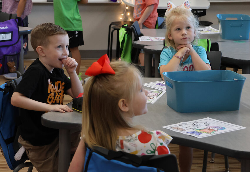 Students at Annetta Elementary School get into the swing early on the first day of classes.