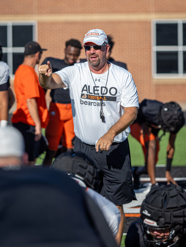 Aledo head coach Robby Jones gives instructions to his players during a drill at the intersquad scrimmage on Saturday, Aug 12.