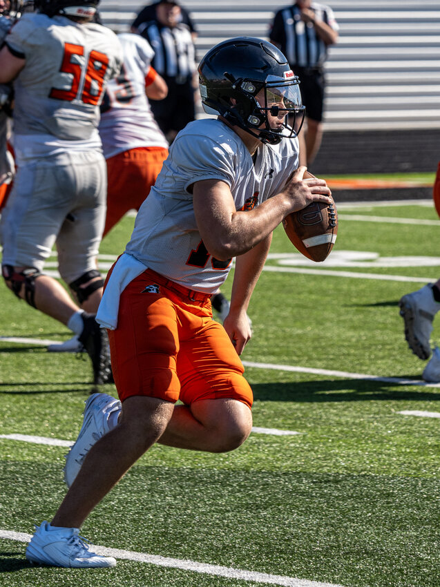 Backup quarterback Lincoln Tubbs rolls out of the pocket before making a throw downfield during Aledo's intersquad scrimmage on Satuday, Aug. 12.