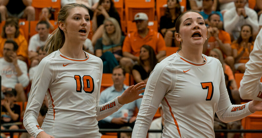 Juniors Haley Lowe and Kinley Elms rally the Ladycats at the start of the match with Paschall on Tuesday, Aug. 29.