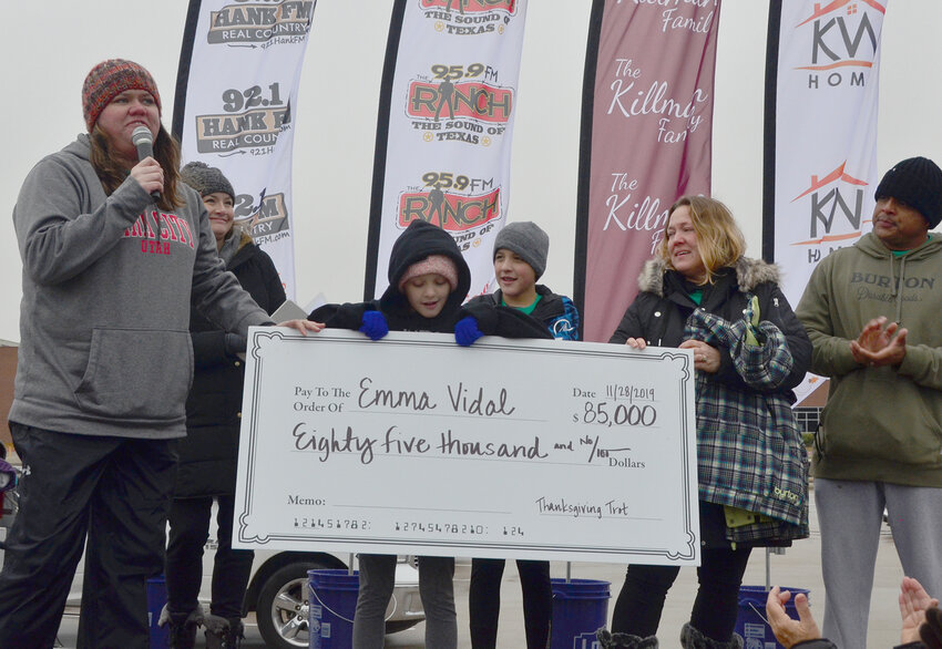 Whitney Harris, Left, presented the 2019 check for $85,000 to the family of Emma Vidal.