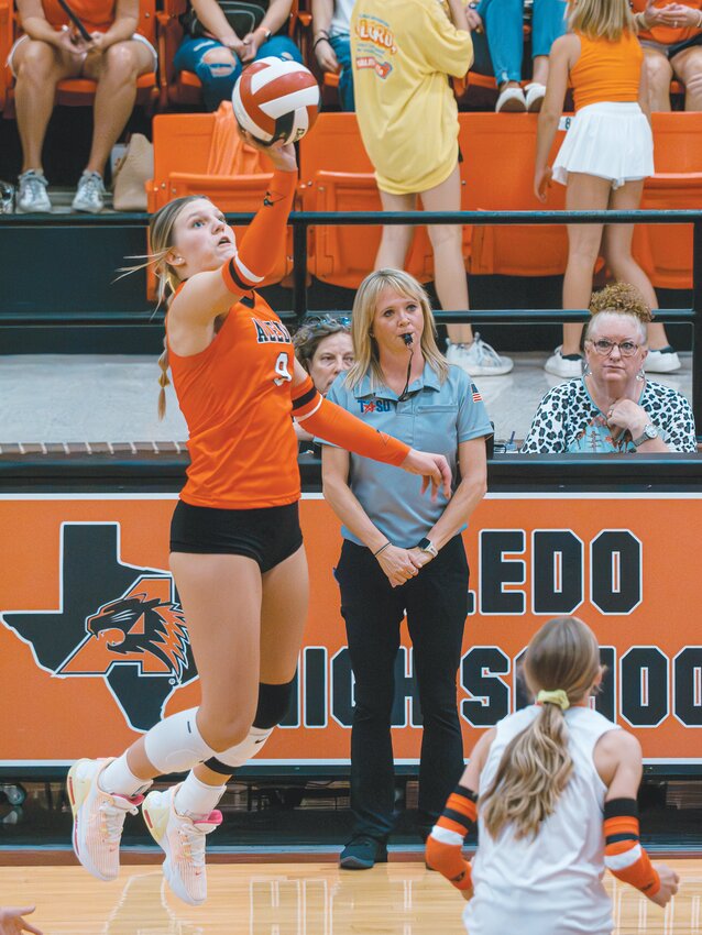 Kaelee Berkley elevates to lob a shot over the net against Northwest during the district opener on Friday, Sept. 8.