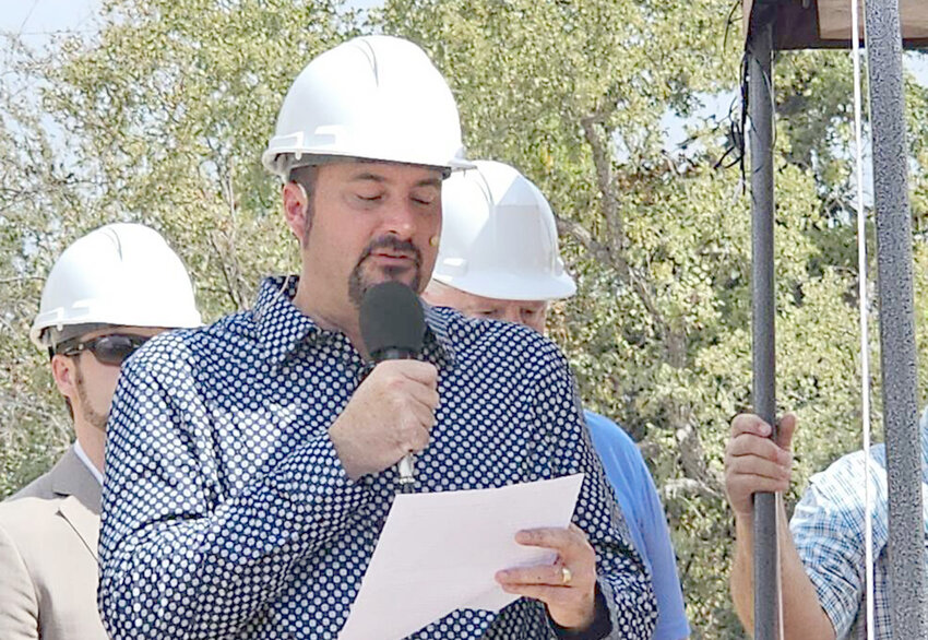Pastor Brandon Carter provides comments to the congregation during the groundbreaking ceremony.
