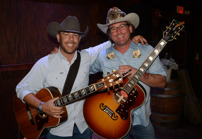 Lone Star Parish, a Parker County-based country duo consisting of Brandon Tatarevich and Chuck Yielding, entertains the Grace Ministry banquet before and during the dinner.