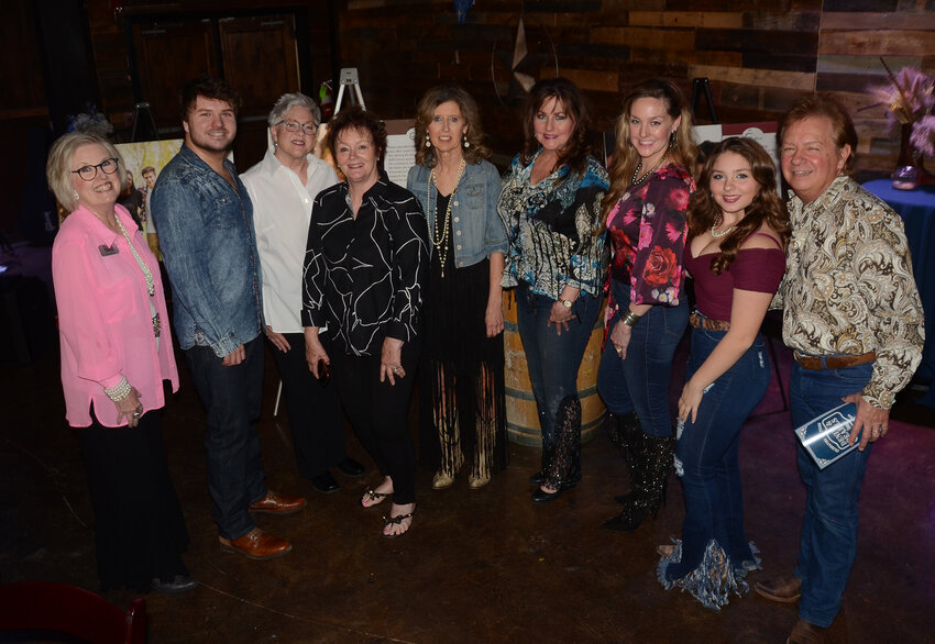 Stallion 7 Productions, a Weatherford-based acting and entertaining company, prepare to present a drama production for the banquet. With Jo Warren, left, are Stallion 7 members Joe Warren, Judy Fox, Debra Lowry, Patty Forsyth, Billy Beggs, Carol Beggs, Peggy Lunsford, Evan Beggs, and Byrdi Beggs.