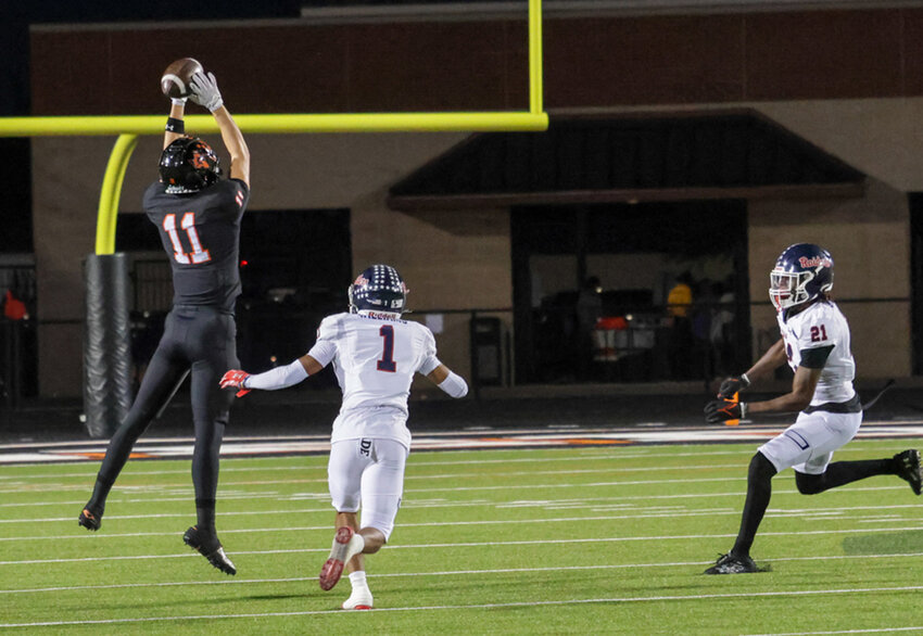 Trace Clarkson leaps for a catch against Ryan.  Clarkson had three catches for 33 yards.