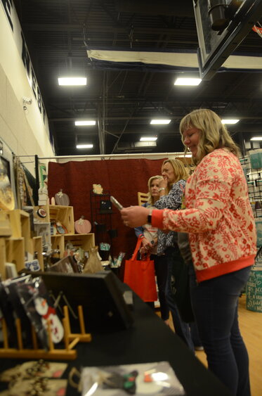 Julie Thomas enjoys rows of crafts and gifts at the TCA Gift Fair.