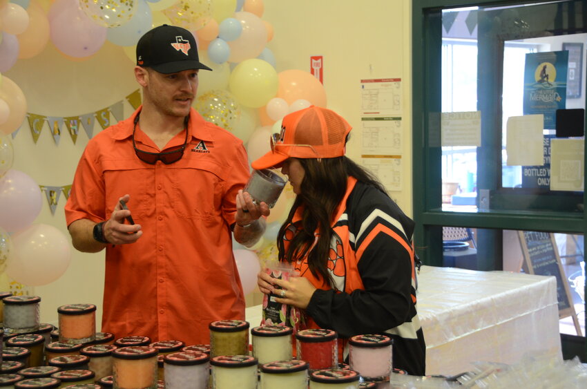 Taylor and Cameron Trapp select scented gifts from the Blessings Candle Store.
