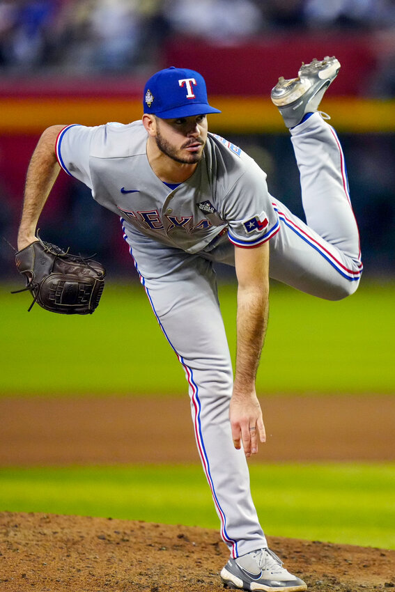 PHOENIX, AZ - OCTOBER 31: Cody Bradford #61 of the Texas Rangers pitches in the seventh inning during Game 4 of the 2023 World Series between the Texas Rangers and the Arizona Diamondbacks at Chase Field on Tuesday, October 31, 2023 in Phoenix, Arizona. (Photo by Daniel Shirey/MLB Photos via Getty Images)