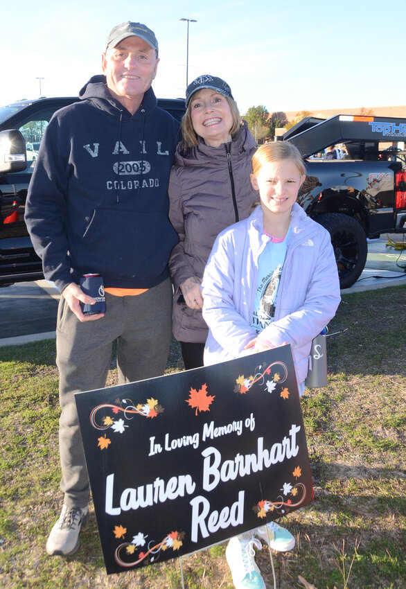 Thanksgiving Trot beneficiary Lauren Barnhart Reed was honored by parents Joe and Sharon Barnhart and daughter Leighton Reed before the race. Lauren was the beneficiary of the 2015 race and passed away in 2018.