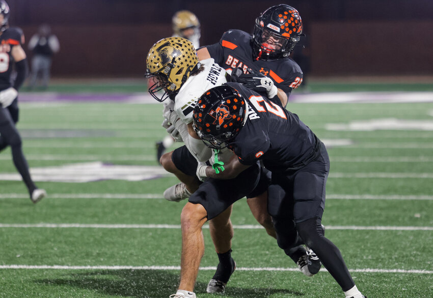 Jaden Allen (2) and Ben McElree (22) pull down an Abilene ball carrier. The Bearcat defense held Abilene to an unofficial minus-three yards in the game.